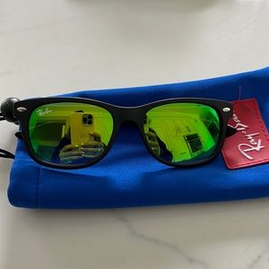 Little kid original ray bans with green mirror lenses.